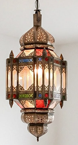 Moroccan hexagon lantern with decorative metalwork and colored glass